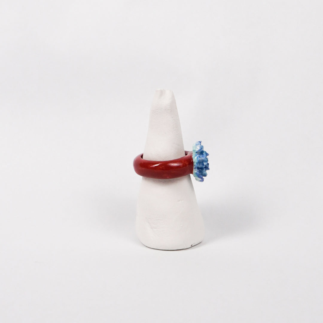 blue-peony-ceramic-ring-Leap-And-Linger-Product-Rings-by-Nomi-Bui-With-Stand-2nd-Angle