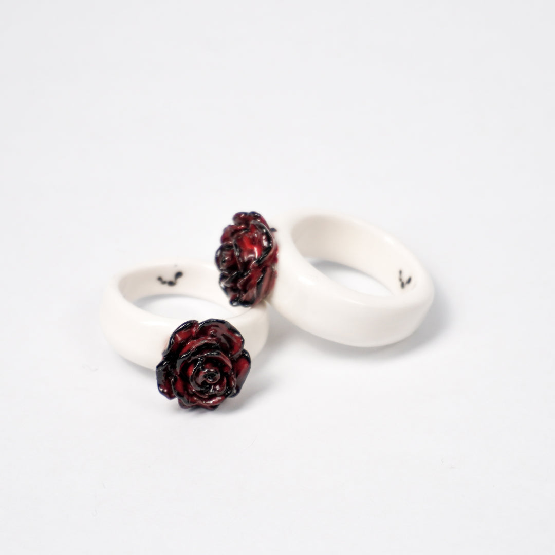 love-rosie-deep-love-ceramic-ring-clearance-ring-body-is-different-color-from-original-Leap-And-Linger-Product-Rings-by-Nomi-Bui-With-Stand-1st-Angle