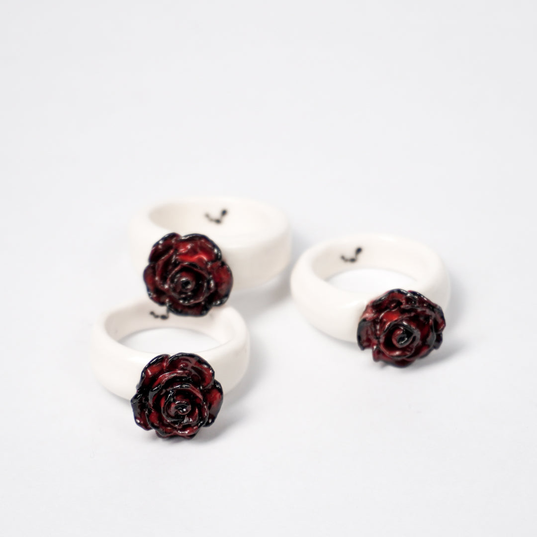 love-rosie-deep-love-ceramic-ring-clearance-ring-body-is-different-color-from-original-Leap-And-Linger-Product-Rings-by-Nomi-Bui-With-Stand-2nd-Angle