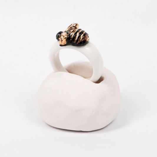 the-endless-flower-garden-bee-edition-with-24k-gold-ceramic-ring-Leap-And-Linger-Product-Rings-by-Nomi-Bui-With-Hand-1st-Angle