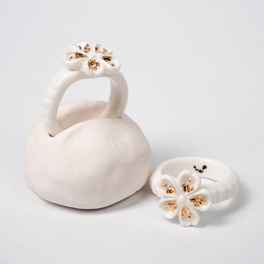 the-endless-flower-garden-fleur-de-pecher-blanche-edition-with-24k-gold-ceramic-ring-Leap-And-Linger-Product-Rings-by-Nomi-Bui-With-Hand-1st-Optional