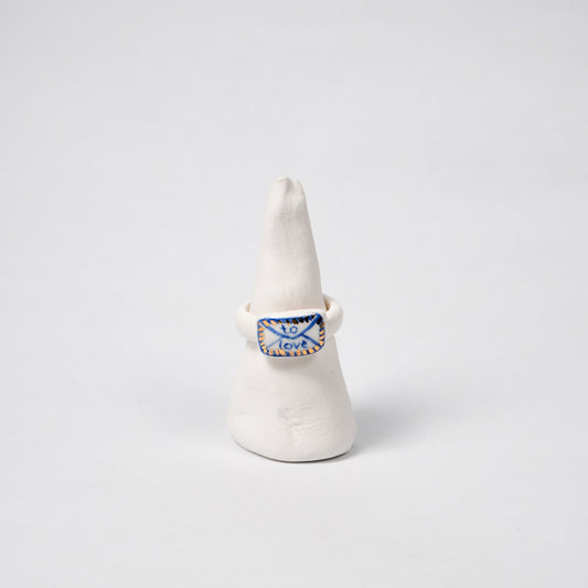 the-notebook-edition-with-24k-gold-ceramic-ring-Leap-And-Linger-Product-Rings-by-Nomi-Bui-With-Stand-1st-Angle