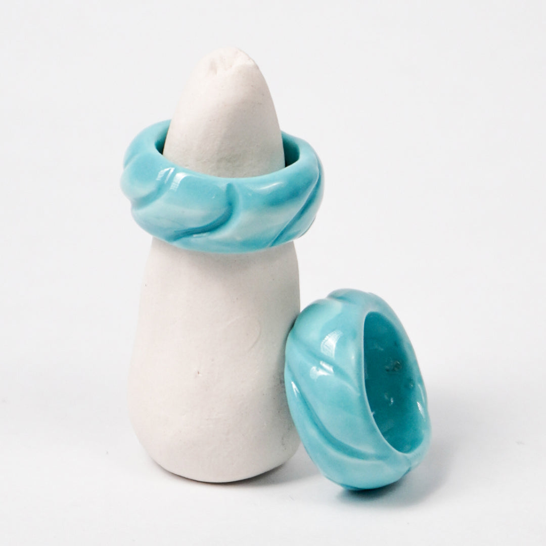 tires-aqua-sky-ceramic-ring-Leap-And-Linger-Product-Rings-by-Nomi-Bui-With-Stand-2nd-Angle