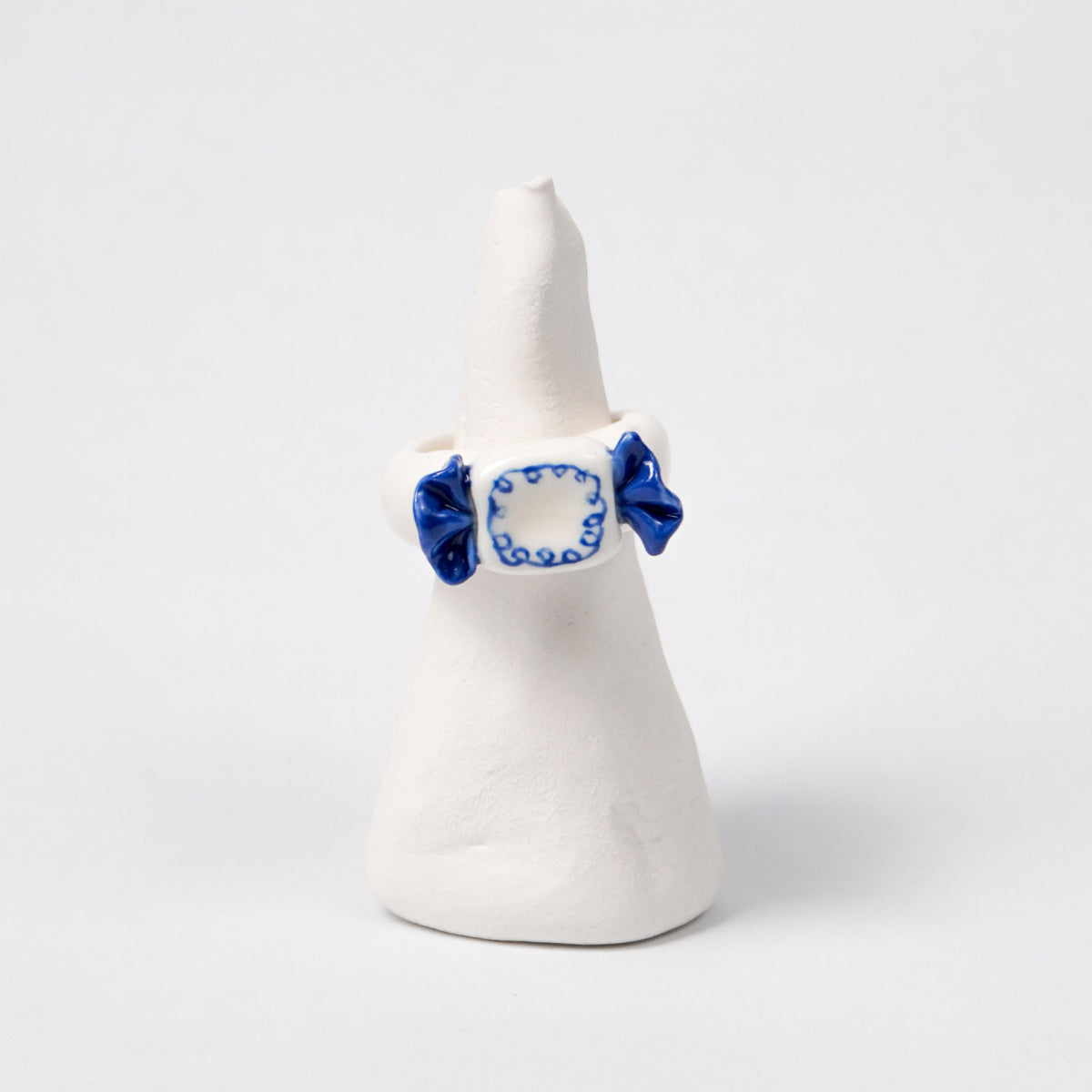 call-me-sweet-candy-porcelain-ring-Leap-And-Linger-Product-Rings-by-Nomi-Bui-With-Stand-1st-Angle