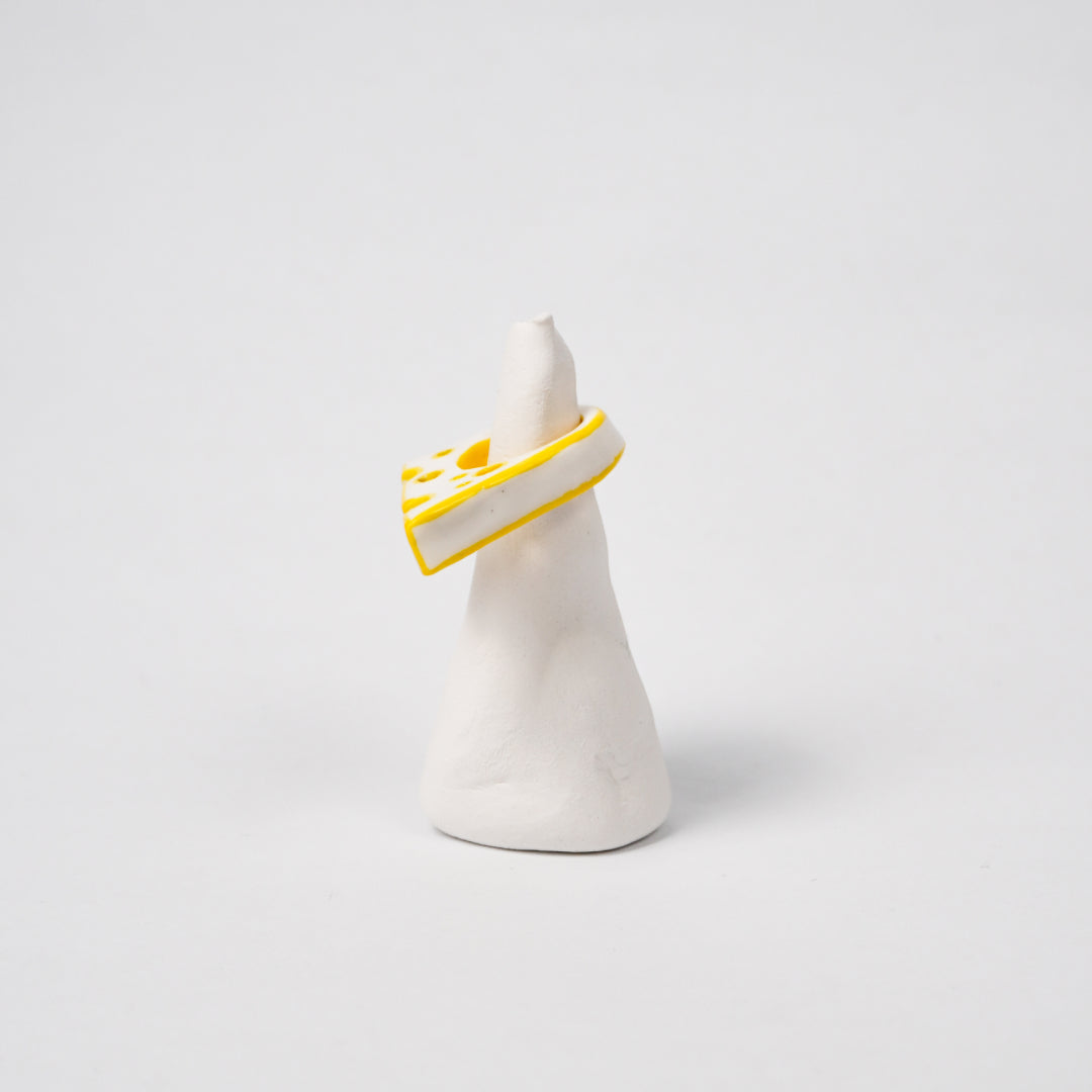 cheese-daughter-drawing-ceramic-ring-Leap-And-Linger-Product-Rings-by-Nomi-Bui-With-Stand-2nd-Angle