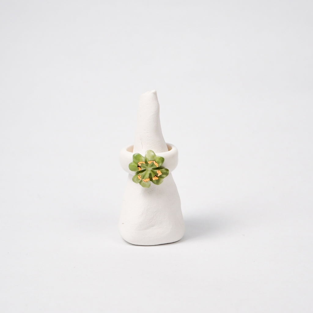 four-leaf-faith-edition-with-24k-gold-ceramic-ring-Leap-And-Linger-Product-Rings-by-Nomi-Bui-With-Stand-1st-Angle