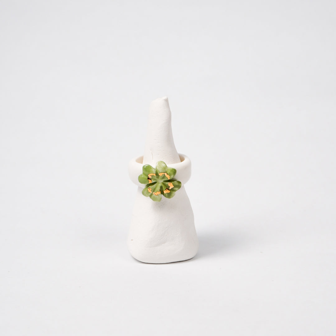 four-leaf-faith-edition-with-24k-gold-ceramic-ring-Leap-And-Linger-Product-Rings-by-Nomi-Bui-With-Stand-1st-Angle
