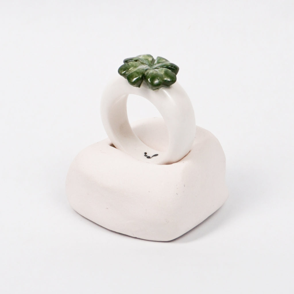 four-leaf-hope-ceramic-ring-Leap-And-Linger-Product-Rings-by-Nomi-Bui-With-Hand-1st-Angle