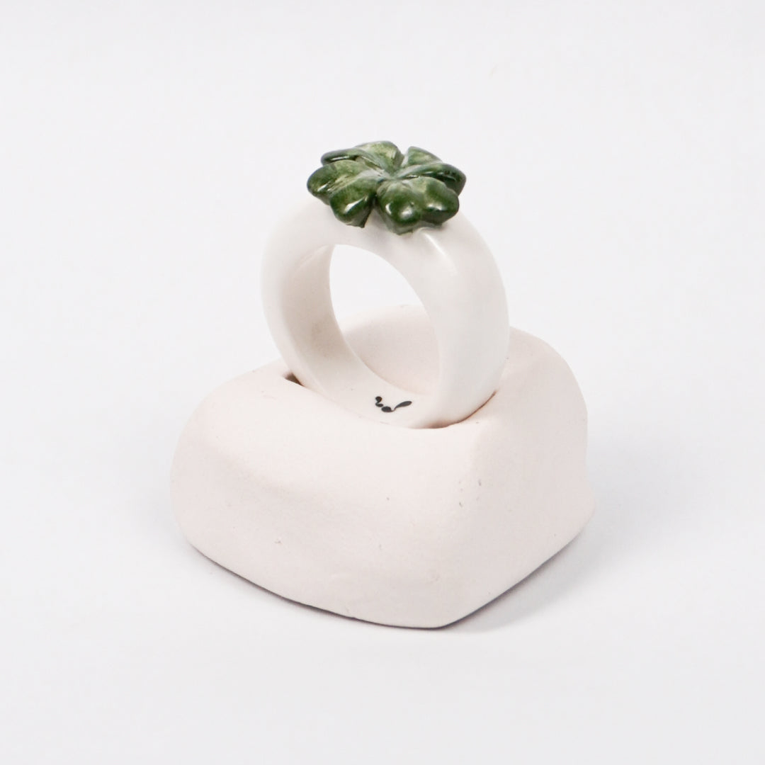 four-leaf-hope-ceramic-ring-Leap-And-Linger-Product-Rings-by-Nomi-Bui-With-Hand-1st-Angle
