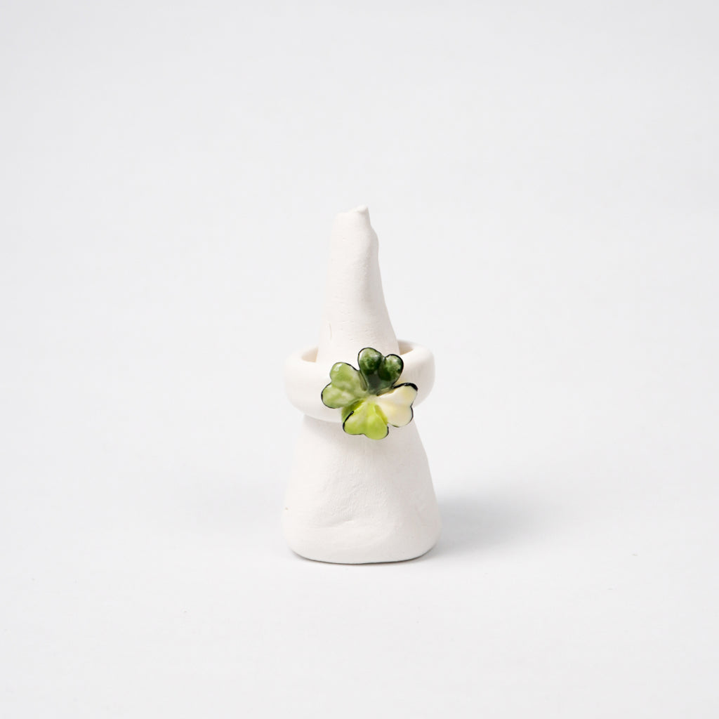four-leaf-love-ceramic-ring-Leap-And-Linger-Product-Rings-by-Nomi-Bui-With-Stand-1st-Angle
