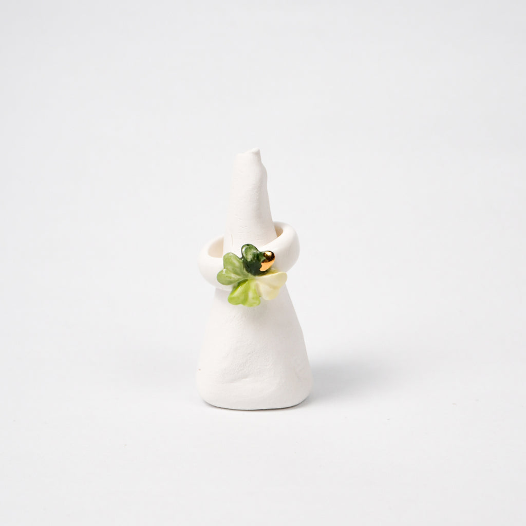 four-leaf-luck-edition-with-24k-gold-ceramic-ring-Leap-And-Linger-Product-Rings-by-Nomi-Bui-With-Stand-1st-Angle