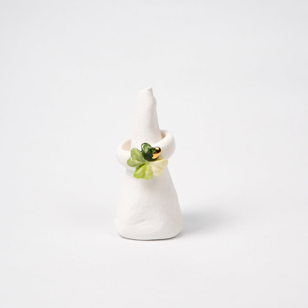 four-leaf-luck-edition-with-24k-gold-ceramic-ring-Leap-And-Linger-Product-Rings-by-Nomi-Bui-With-Stand-1st-Angle