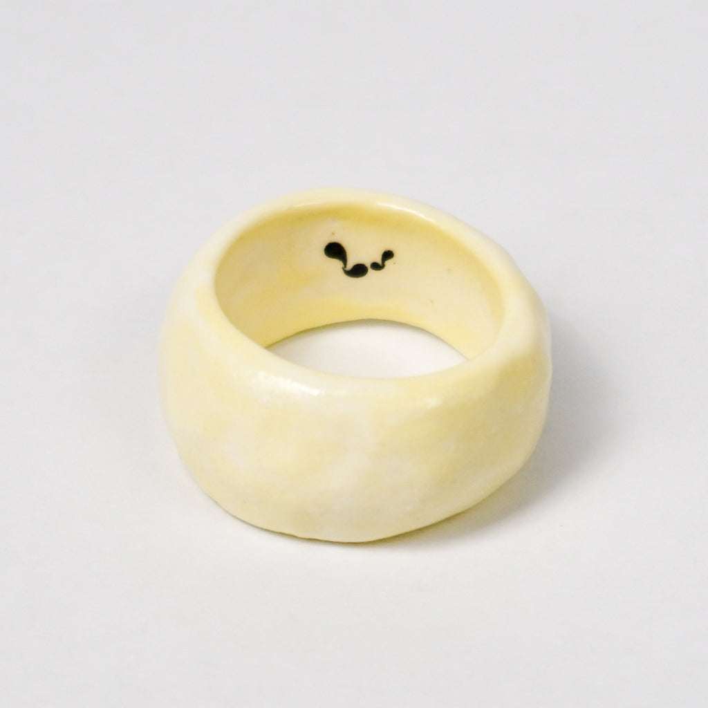 peace-awaken-yellow-porcelain-ring-clearance-slightly-imperfect-Leap-And-Linger-Product-Rings-by-Nomi-Bui-1st-Angle