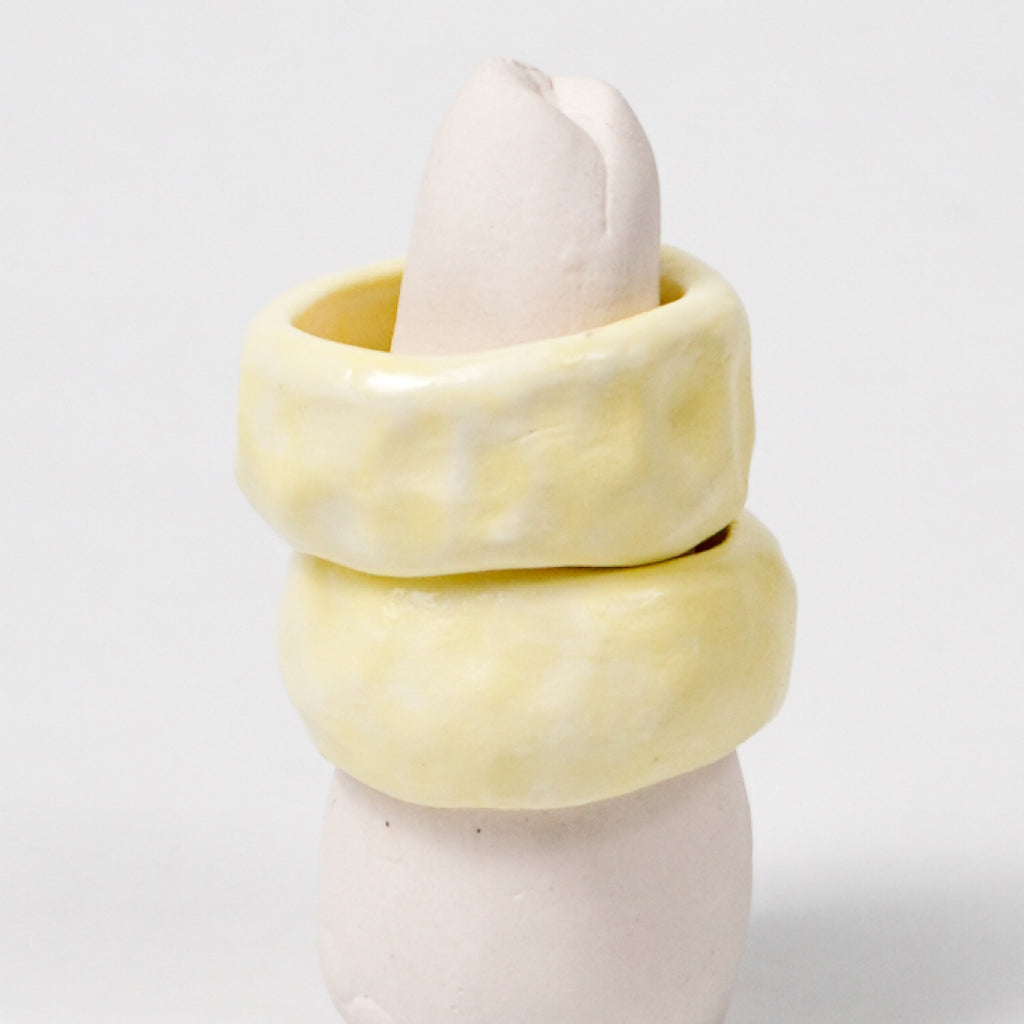 peace-awaken-yellow-porcelain-ring-clearance-slightly-imperfect-Leap-And-Linger-Product-Rings-by-Nomi-Bui-With-Stand-2nd-Angle