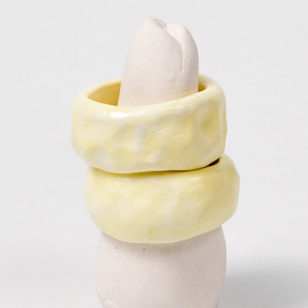 peace-awaken-yellow-porcelain-ring-clearance-slightly-imperfect-Leap-And-Linger-Product-Rings-by-Nomi-Bui-With-Stand-2nd-Angle