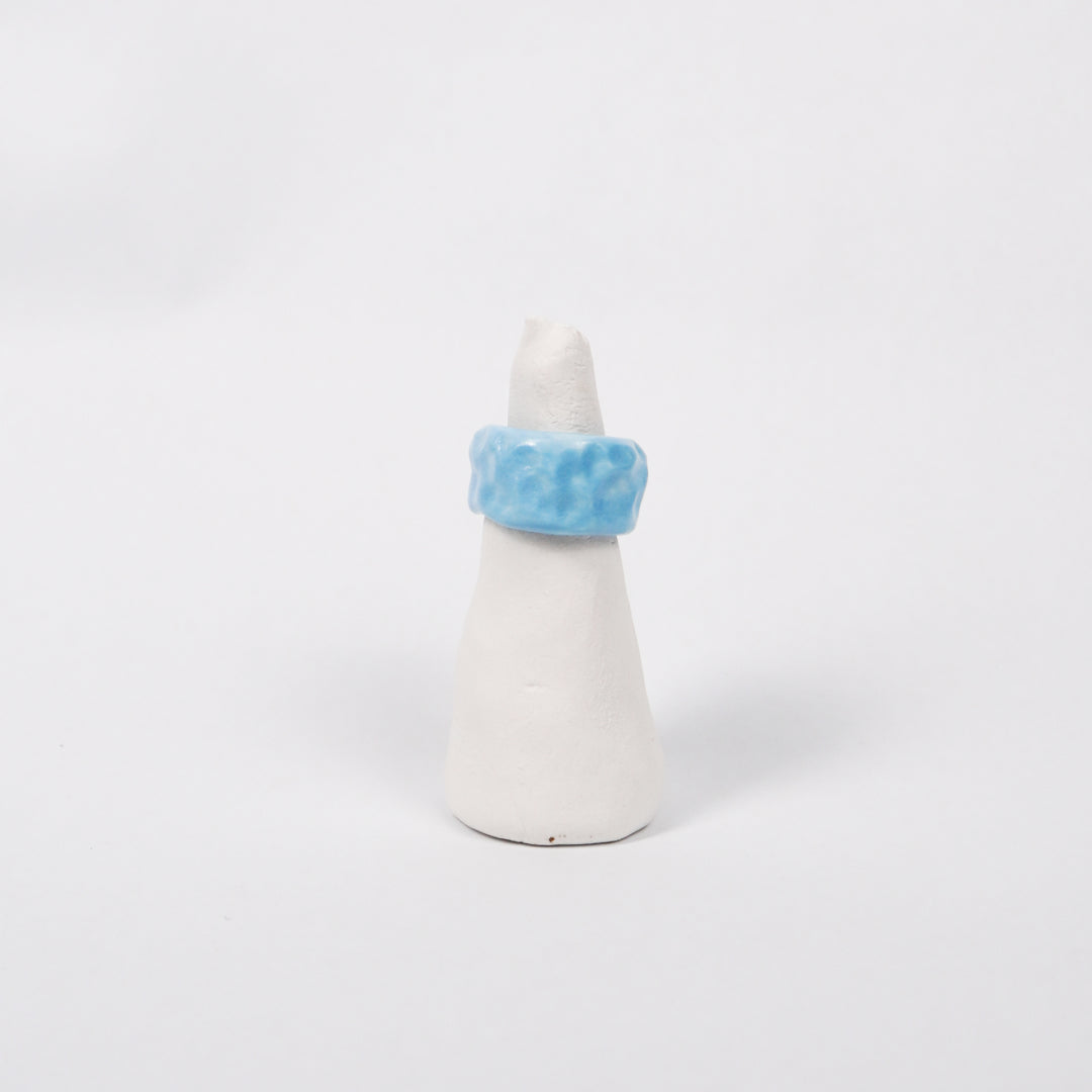 peace-blue-elixir-ceramic-ring-Leap-And-Linger-Product-Rings-by-Nomi-Bui-With-Stand-1st-Angle