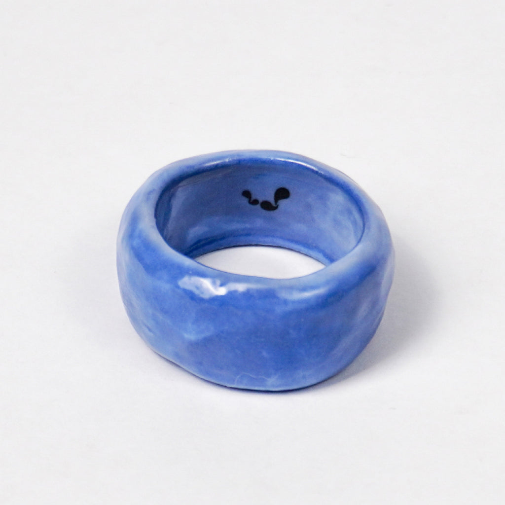 peace-dazzling-blue-ceramic-ring-Leap-And-Linger-Product-Rings-by-Nomi-Bui-1st-Angle