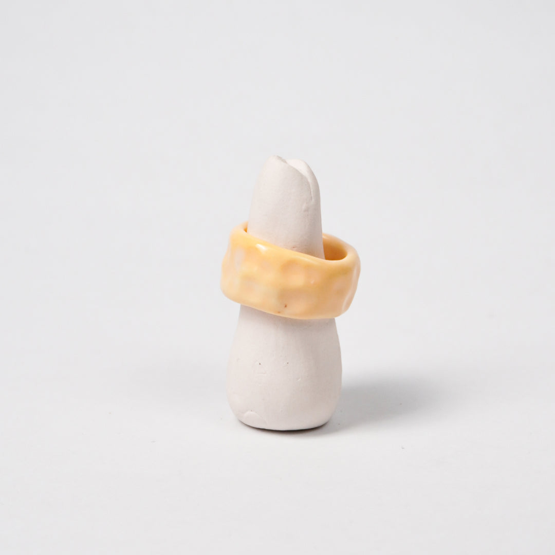 peace-tender-yellow-ceramic-ring-Leap-And-Linger-Product-Rings-by-Nomi-Bui-With-Stand-1st-Angle-1