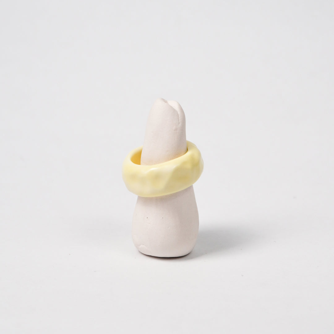 peace-tender-yellow-ceramic-ring-Leap-And-Linger-Product-Rings-by-Nomi-Bui-With-Stand-1st-Angle