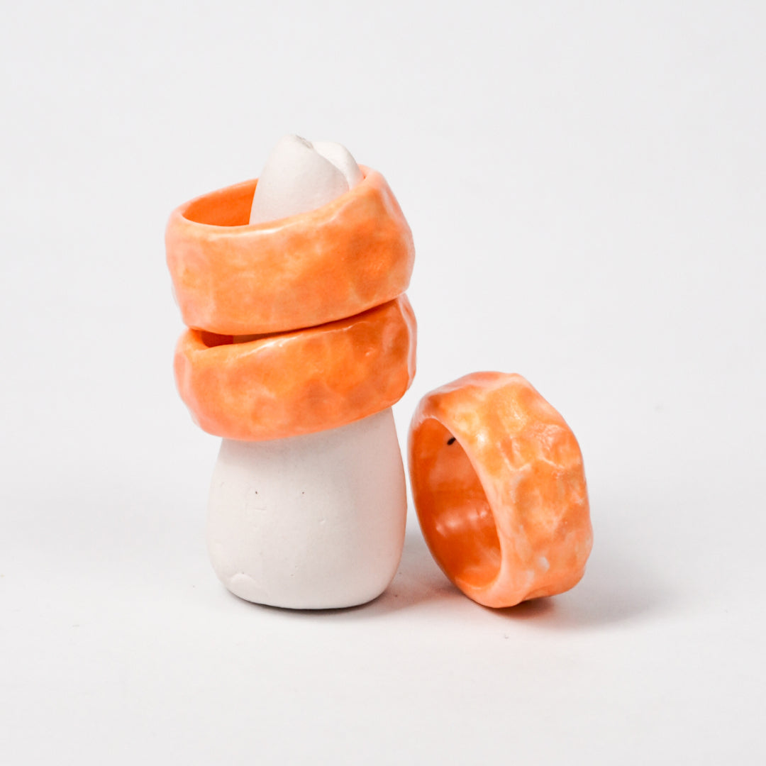 peace-vibrant-orange-porcelain-ring-Leap-And-Linger-Product-Rings-by-Nomi-Bui-With-Stand-2nd-Angle