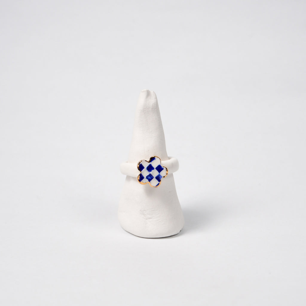 queen-s-gambit-legal-edition-with-24k-gold-ceramic-ring-Leap-And-Linger-Product-Rings-by-Nomi-Bui-With-Stand-1st-Angle