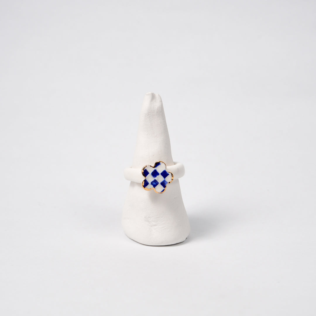 queen-s-gambit-legal-edition-with-24k-gold-ceramic-ring-Leap-And-Linger-Product-Rings-by-Nomi-Bui-With-Stand-1st-Angle