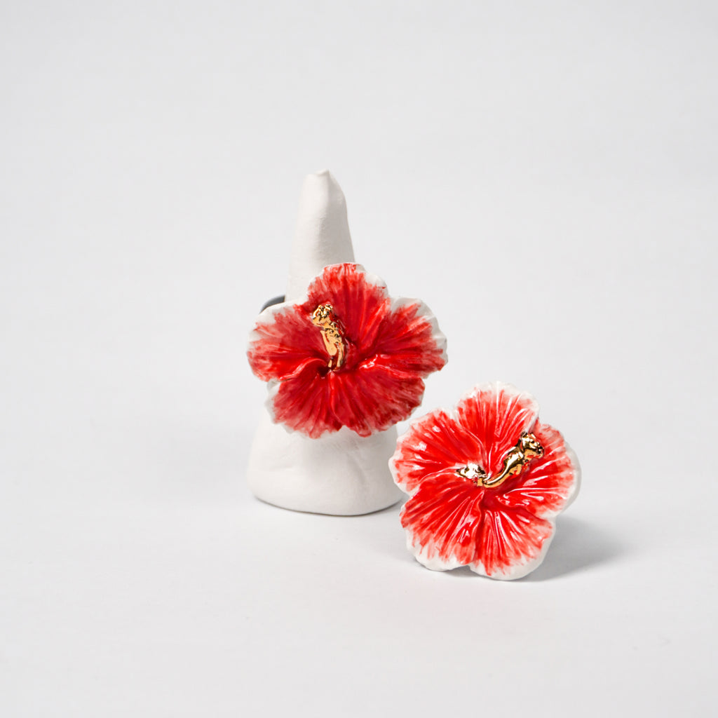 red-hibiscus-edition-with-24k-gold-ceramic-ring-Leap-And-Linger-Product-Rings-by-Nomi-Bui-With-Hand-2nd-Angle