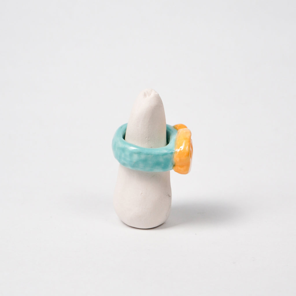 taiyaki-scuba-blue-ceramic-ring-Leap-And-Linger-Product-Rings-by-Nomi-Bui-With-Stand-2nd-Angle