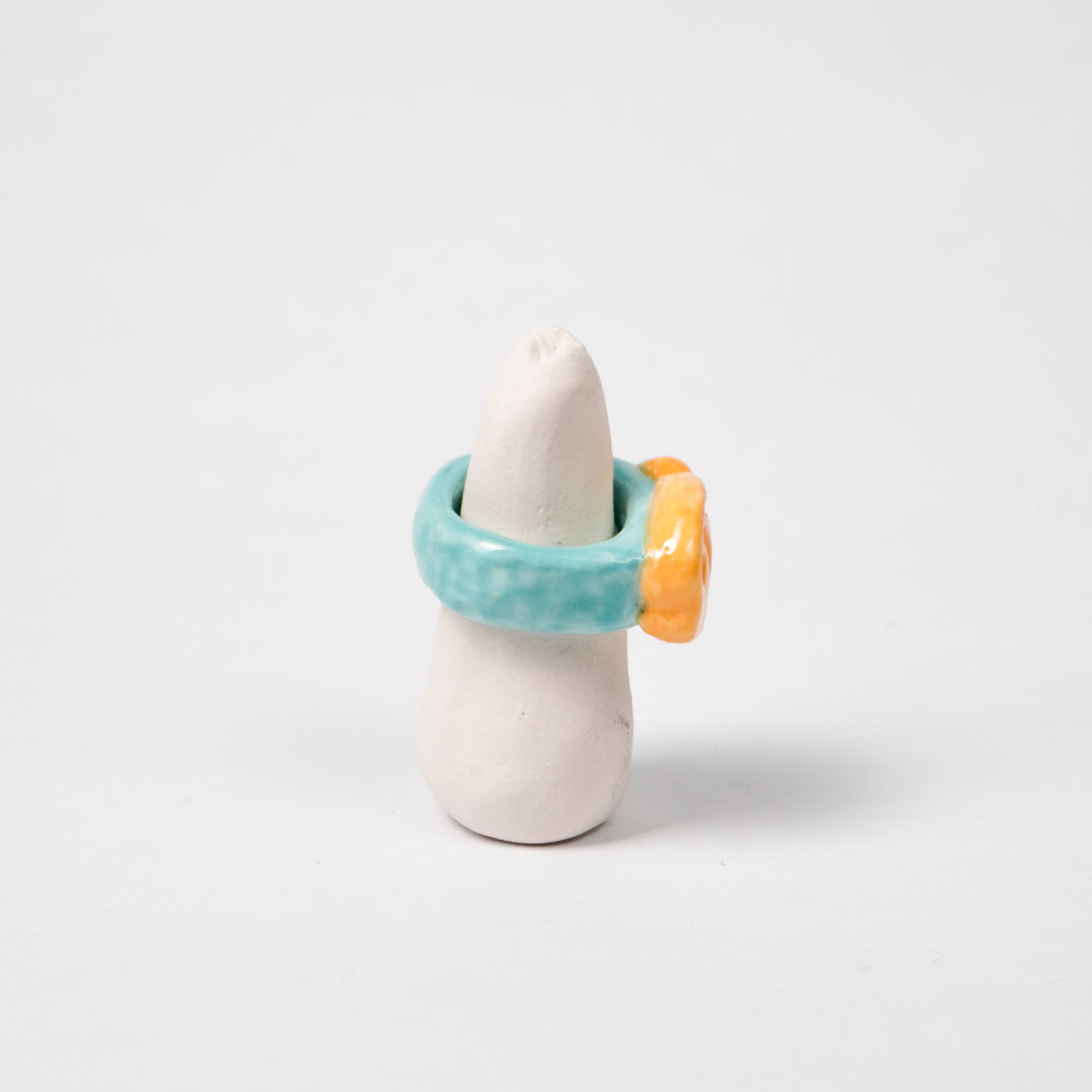 taiyaki-scuba-blue-ceramic-ring-Leap-And-Linger-Product-Rings-by-Nomi-Bui-With-Stand-2nd-Angle