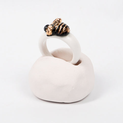 the-endless-flower-garden-bee-edition-with-24k-gold-porcelain-ring-Leap-And-Linger-Product-Rings-by-Nomi-Bui-With-Hand-1st-Angle