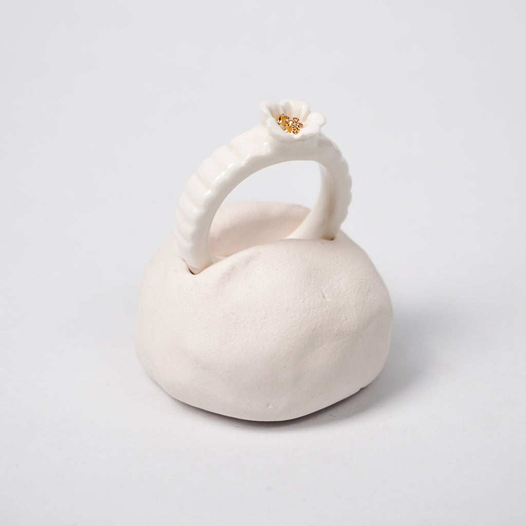 the-endless-flower-garden-delicat-edition-with-24k-gold-porcelain-ring-Leap-And-Linger-Product-Rings-by-Nomi-Bui-With-Hand-1st-Angle