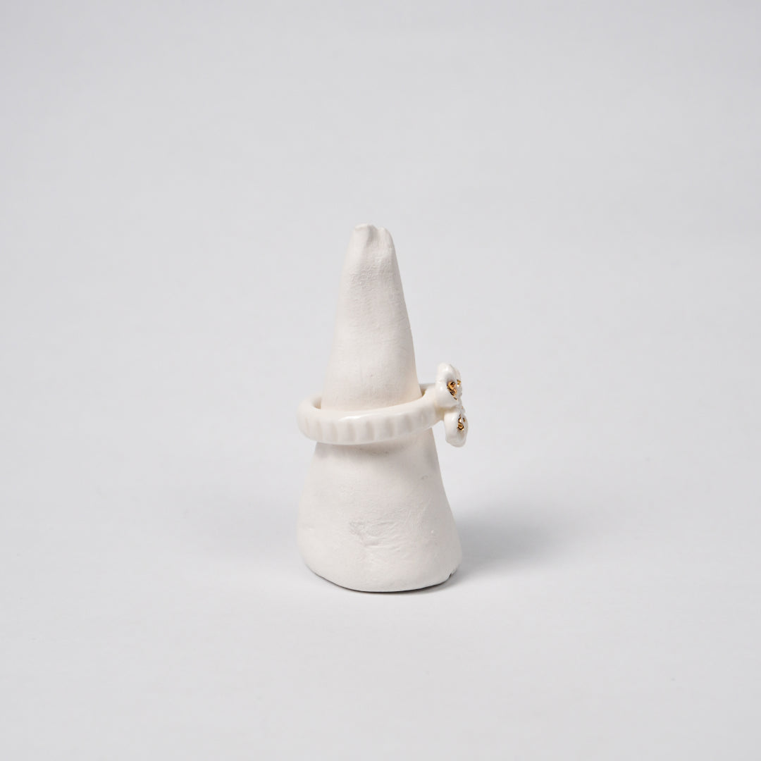 the-endless-flower-garden-fleur-de-pecher-blanche-edition-with-24k-gold-ceramic-ring-Leap-And-Linger-Product-Rings-by-Nomi-Bui-With-Hand-1st-Angle