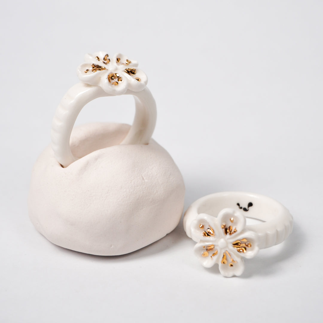 the-endless-flower-garden-fleur-de-pecher-blanche-edition-with-24k-gold-ceramic-ring-Leap-And-Linger-Product-Rings-by-Nomi-Bui-With-Hand-1st-Optional