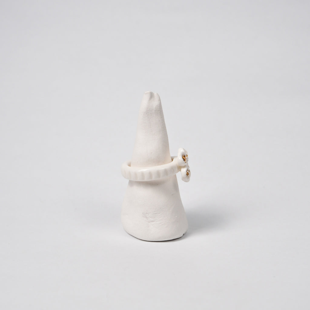 the-endless-flower-garden-fleur-de-pecher-blanche-edition-with-24k-gold-porcelain-ring-Leap-And-Linger-Product-Rings-by-Nomi-Bui-With-Hand-1st-Angle