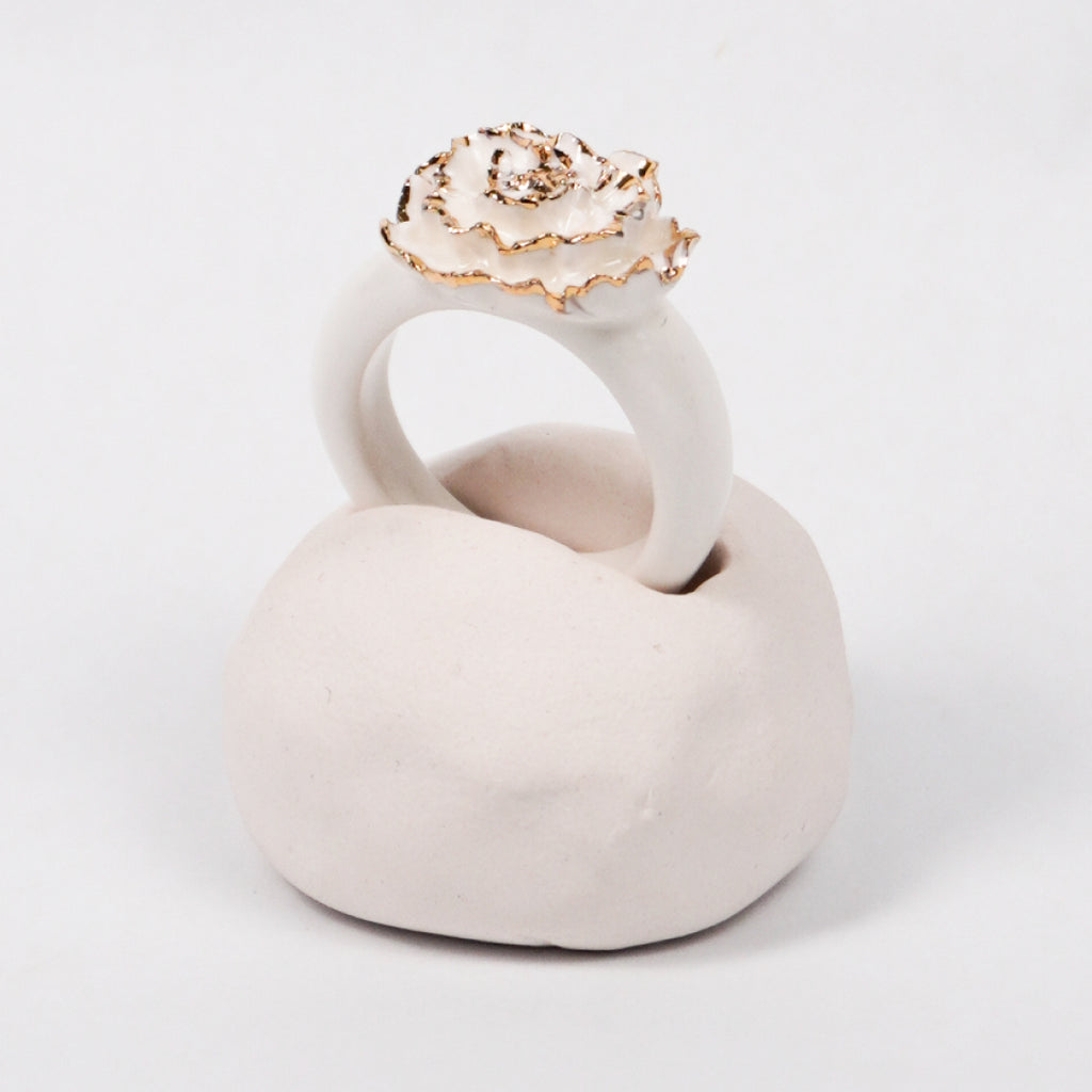 the-endless-flower-garden-mariee-blanche-edition-with-24k-gold-porcelain-ring-Leap-And-Linger-Product-Rings-by-Nomi-Bui-With-Hand-1st-Angle