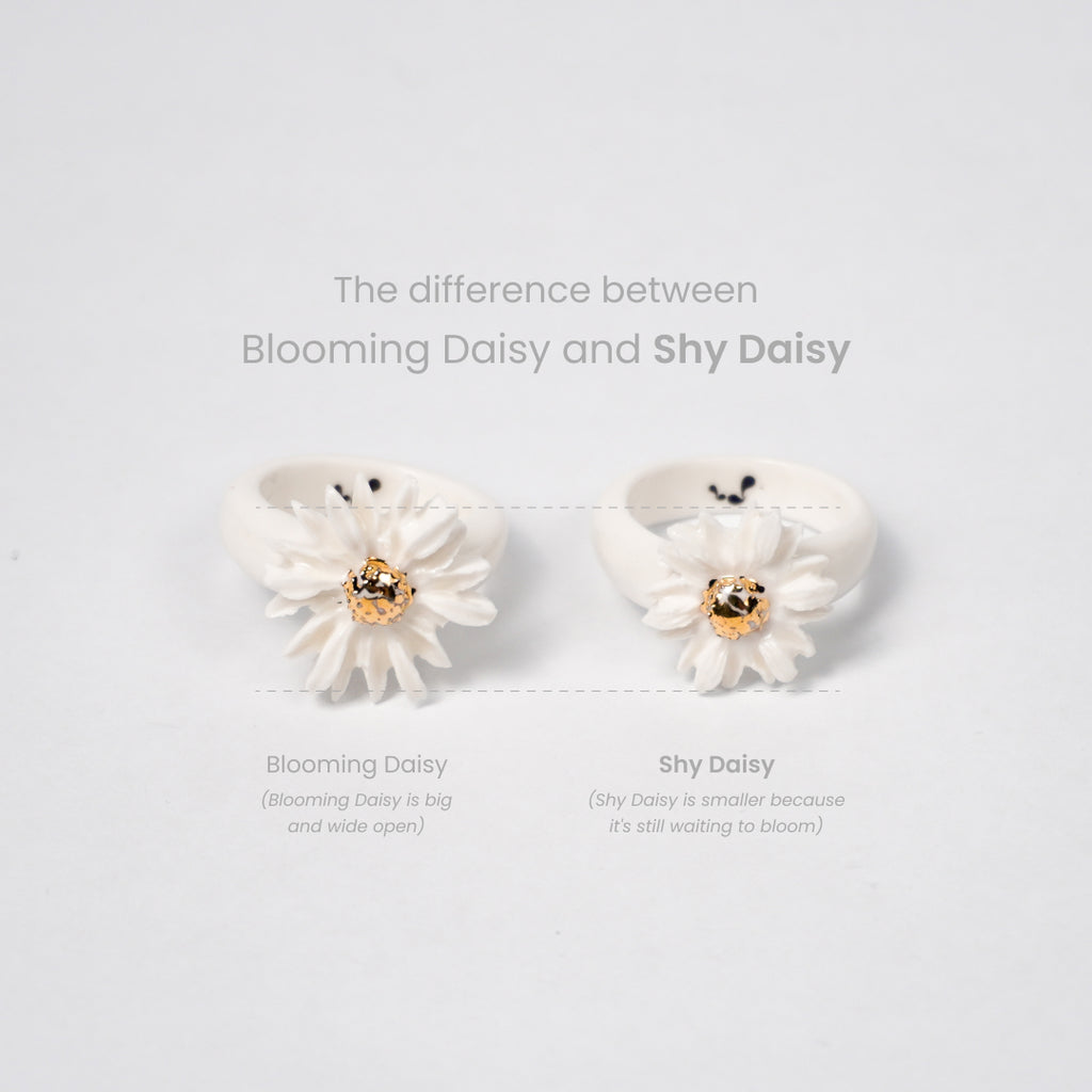 the-endless-flower-garden-shy-daisy-edition-with-24k-gold-ceramic-ring-Leap-And-Linger-Product-Rings-by-Nomi-Bui-With-Hand-1st-Angle