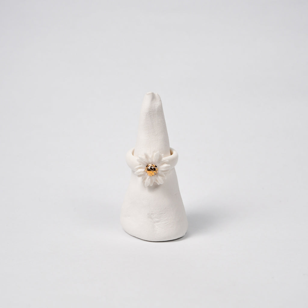 the-endless-flower-garden-shy-daisy-edition-with-24k-gold-porcelain-ring-Leap-And-Linger-Product-Rings-by-Nomi-Bui-With-Stand-1st-Angle