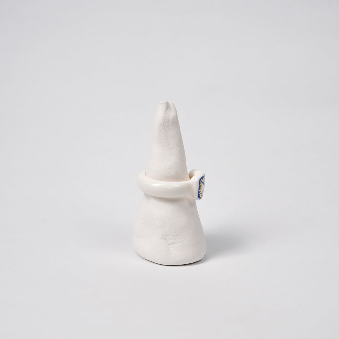 the-notebook-edition-with-24k-gold-porcelain-ring-Leap-And-Linger-Product-Rings-by-Nomi-Bui-With-Stand-2nd-Angle