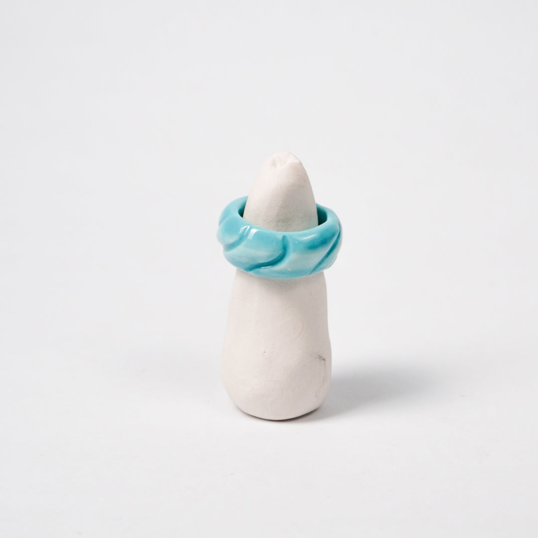 tires-aqua-sky-ceramic-ring-Leap-And-Linger-Product-Rings-by-Nomi-Bui-With-Stand-1st-Angle