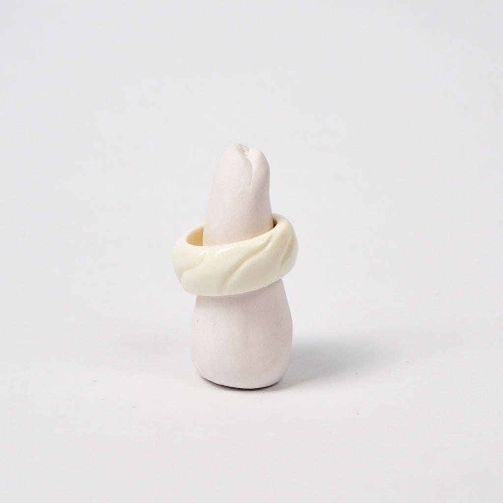 tires-lucent-white-ceramic-ring-Leap-And-Linger-Product-Rings-by-Nomi-Bui-With-Stand-1st-Angle