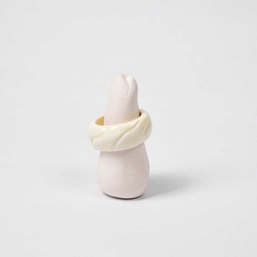 tires-lucent-white-ceramic-ring-Leap-And-Linger-Product-Rings-by-Nomi-Bui-With-Stand-1st-Angle
