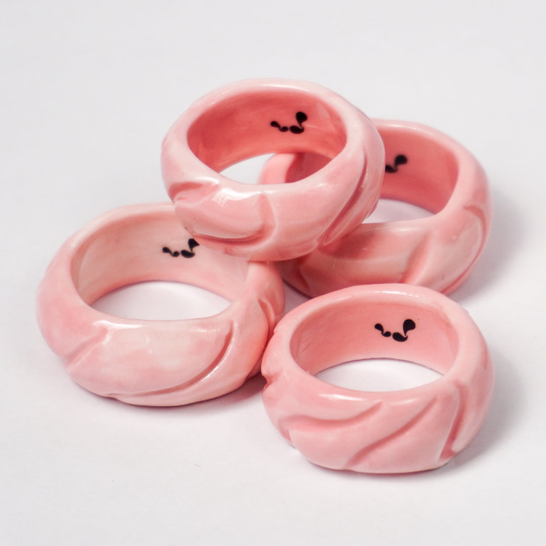 tires-pink-jump-ceramic-ring-Leap-And-Linger-Product-Rings-by-Nomi-Bui-With-Stand-1st-Angle