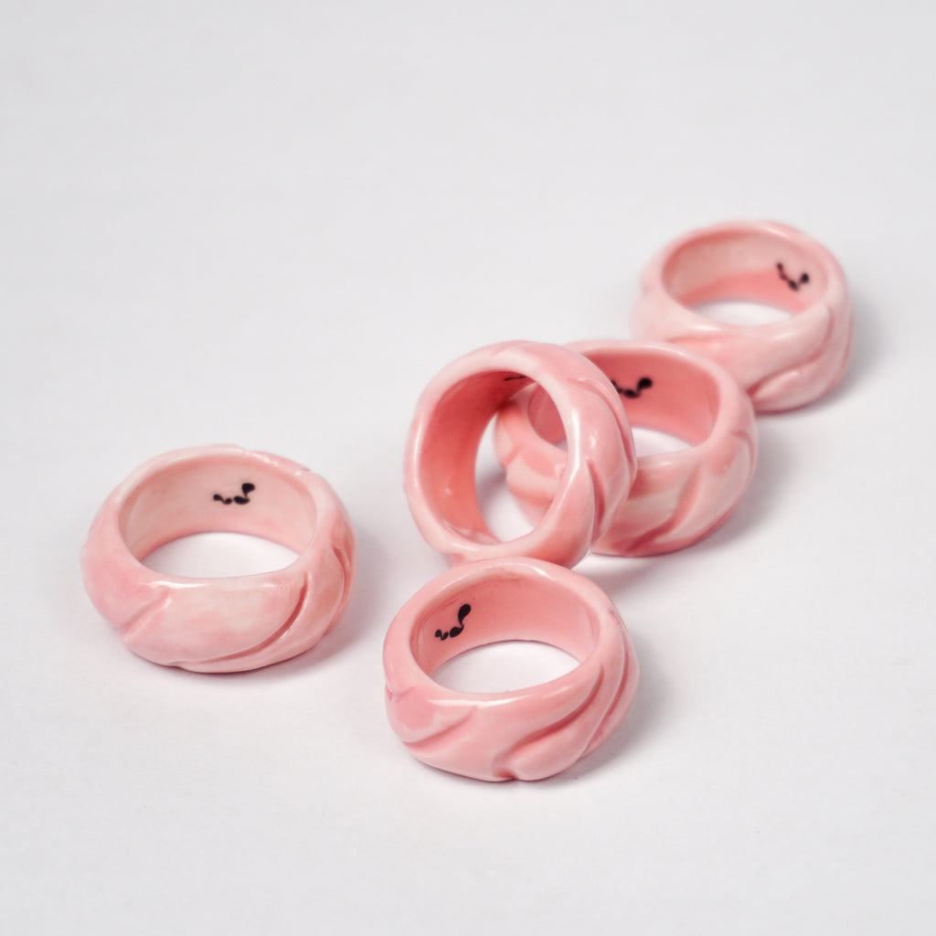 tires-pink-jump-ceramic-ring-Leap-And-Linger-Product-Rings-by-Nomi-Bui-With-Stand-2nd-Angle