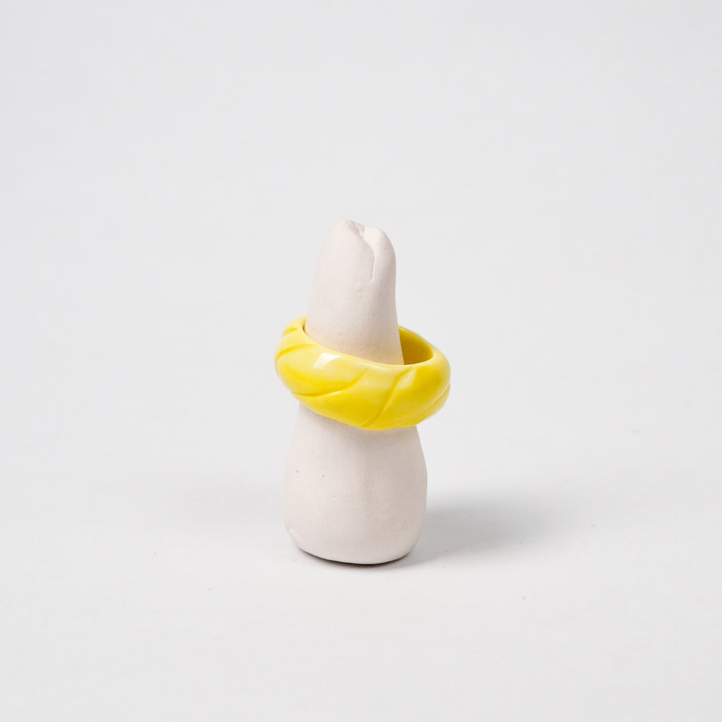 tires-vibrant-yellow-ceramic-ring-Leap-And-Linger-Product-Rings-by-Nomi-Bui-With-Stand-1st-Angle