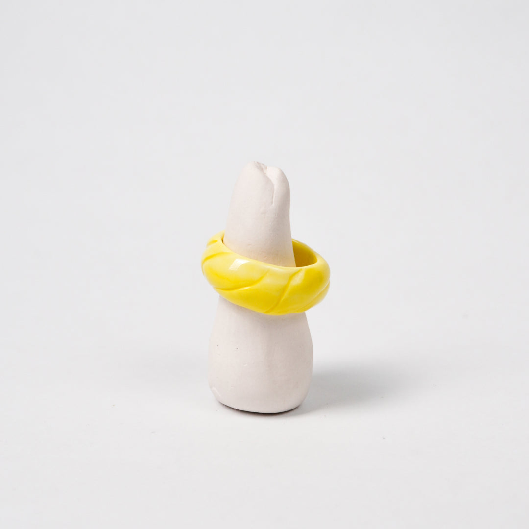 tires-vibrant-yellow-ceramic-ring-Leap-And-Linger-Product-Rings-by-Nomi-Bui-With-Stand-1st-Angle