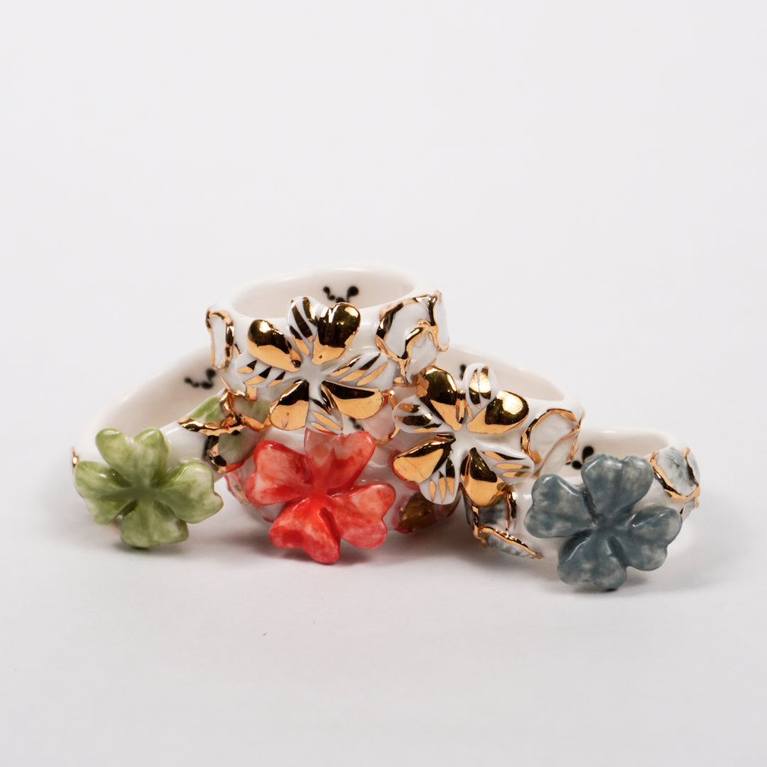 trefle-doux-le-phenix-en-flammes-edition-with-24k-gold-porcelain-ring-Leap-And-Linger-Product-Rings-by-Nomi-Bui-With-Hand-1st-Angle-1
