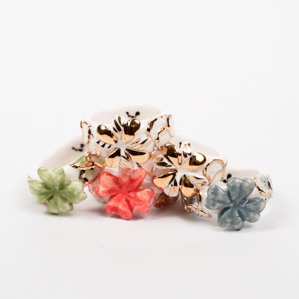 trefle-doux-princesse-edition-with-24k-gold-ceramic-ring-Leap-And-Linger-Product-Rings-by-Nomi-Bui-With-Hand-2nd-Angle