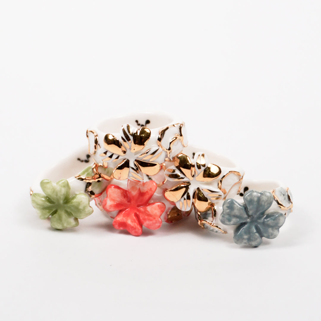 trefle-doux-princesse-edition-with-24k-gold-ceramic-ring-Leap-And-Linger-Product-Rings-by-Nomi-Bui-With-Hand-2nd-Angle
