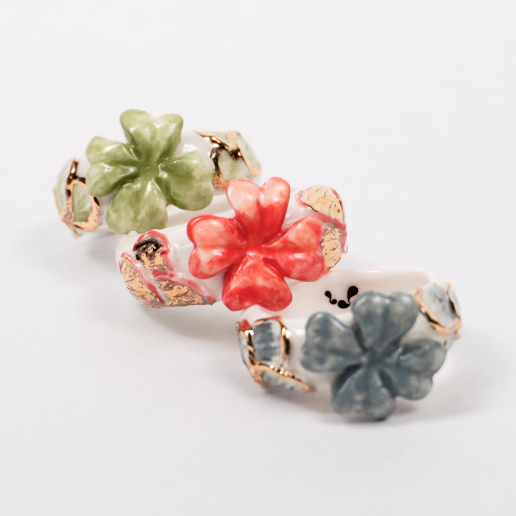 trefle-doux-princesse-edition-with-24k-gold-ceramic-ring-Leap-And-Linger-Product-Rings-by-Nomi-Bui-With-Hand-3rd-Angle