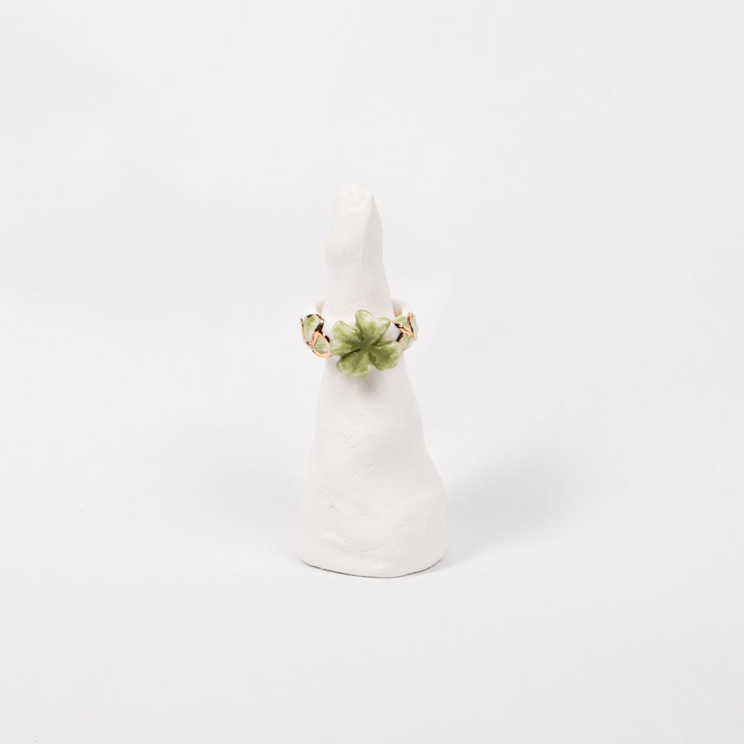 trefle-doux-princesse-edition-with-24k-gold-ceramic-ring-Leap-And-Linger-Product-Rings-by-Nomi-Bui-With-Stand-1st-Angle